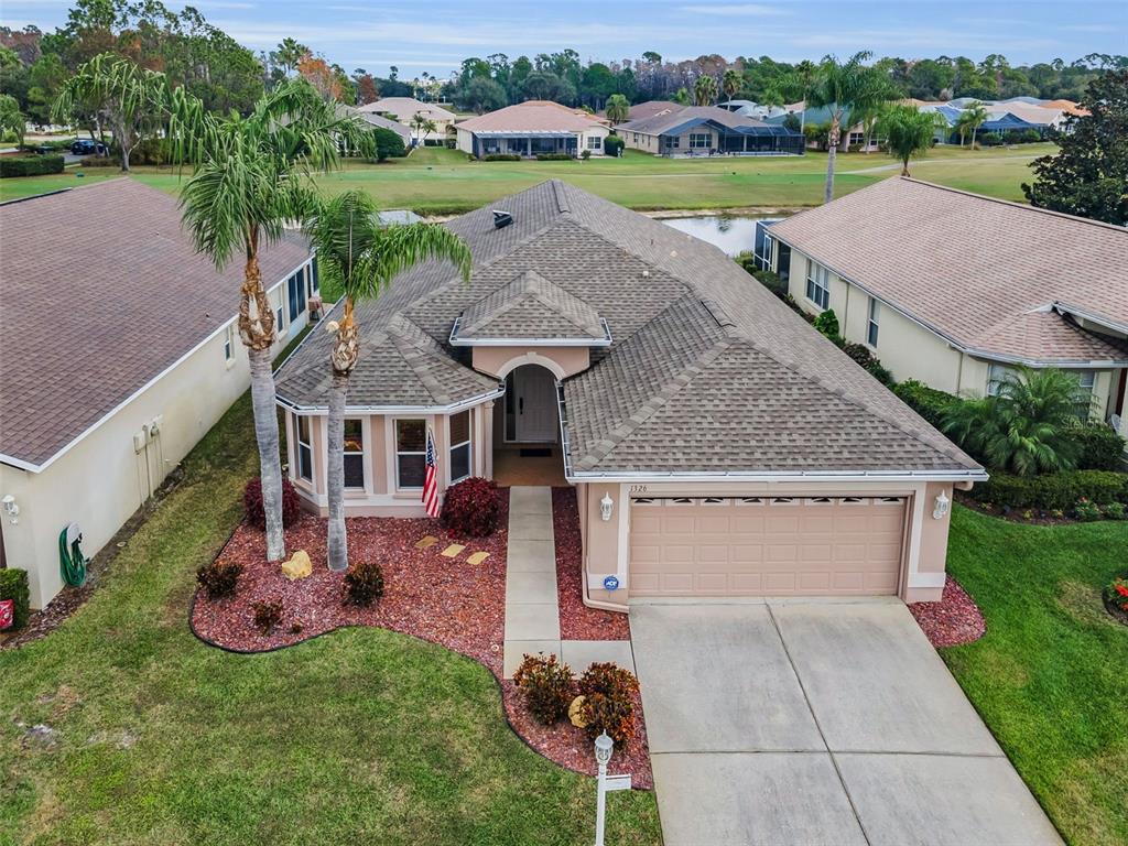 1326 Winding Willow Drive Trinity, FL 34655 - Photo 3 of 100 an aerial view of a house with garden space and lake view