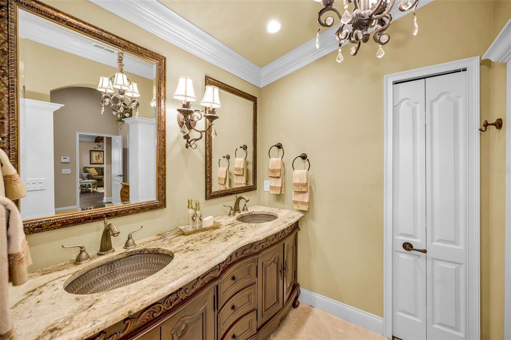 1326 Winding Willow Drive Trinity, FL 34655 - Photo 33 of 100 a bathroom with a granite countertop sink a large mirror and a shower