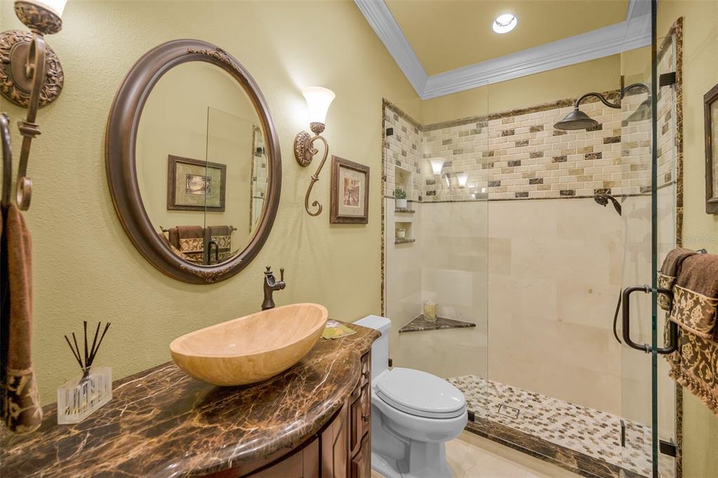 1326 Winding Willow Drive Trinity, FL 34655 - Photo 36 of 100 a bathroom with a toilet a sink and a shower