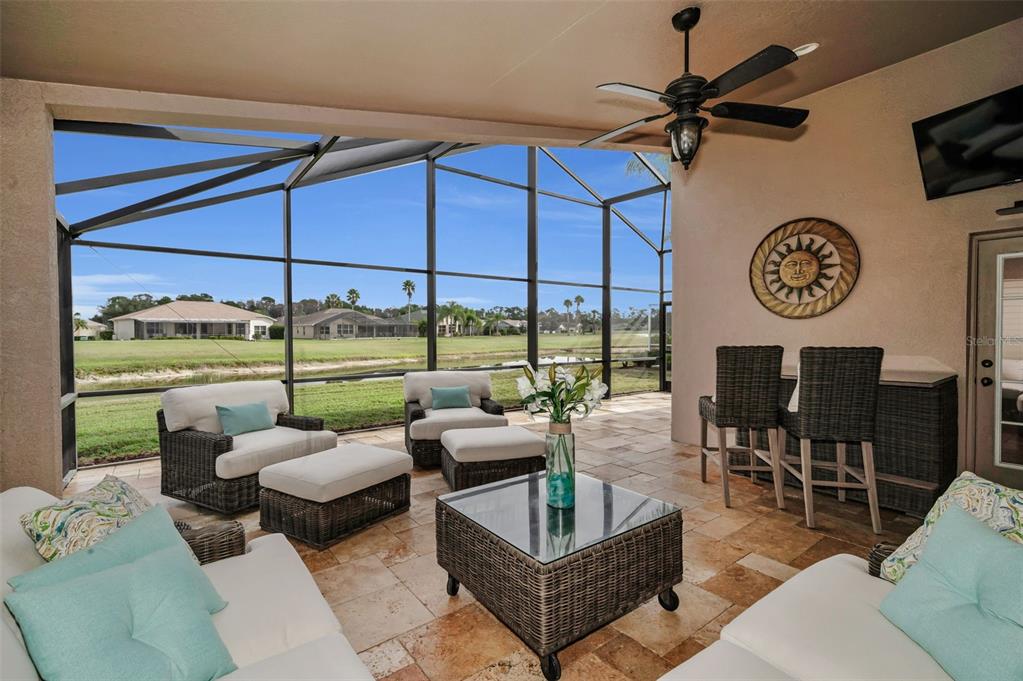 1326 Winding Willow Drive Trinity, FL 34655 - Photo 41 of 100 a living room with patio furniture and a large window