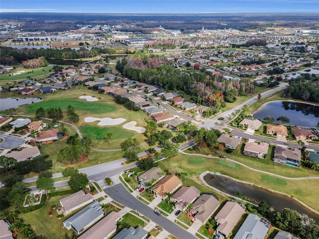 1326 Winding Willow Drive Trinity, FL 34655 - Photo 48 of 100 an aerial view of a city with lots of residential buildings ocean and mountain view in back
