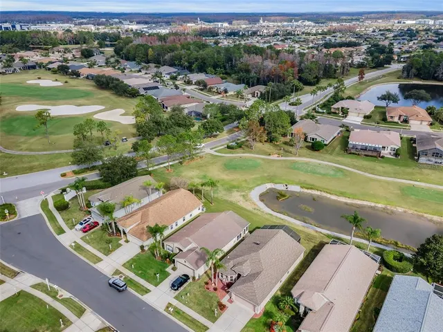 a view of a lake with houses in the background