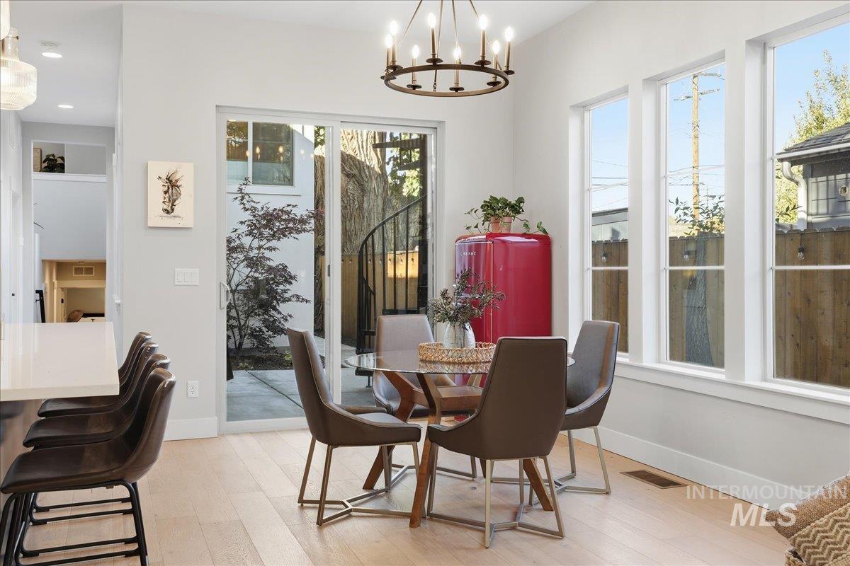 2129 North 34th Street Boise, ID 83703 - Photo 17 of 50 Dining room featuring light wood-type flooring and a chandelier
