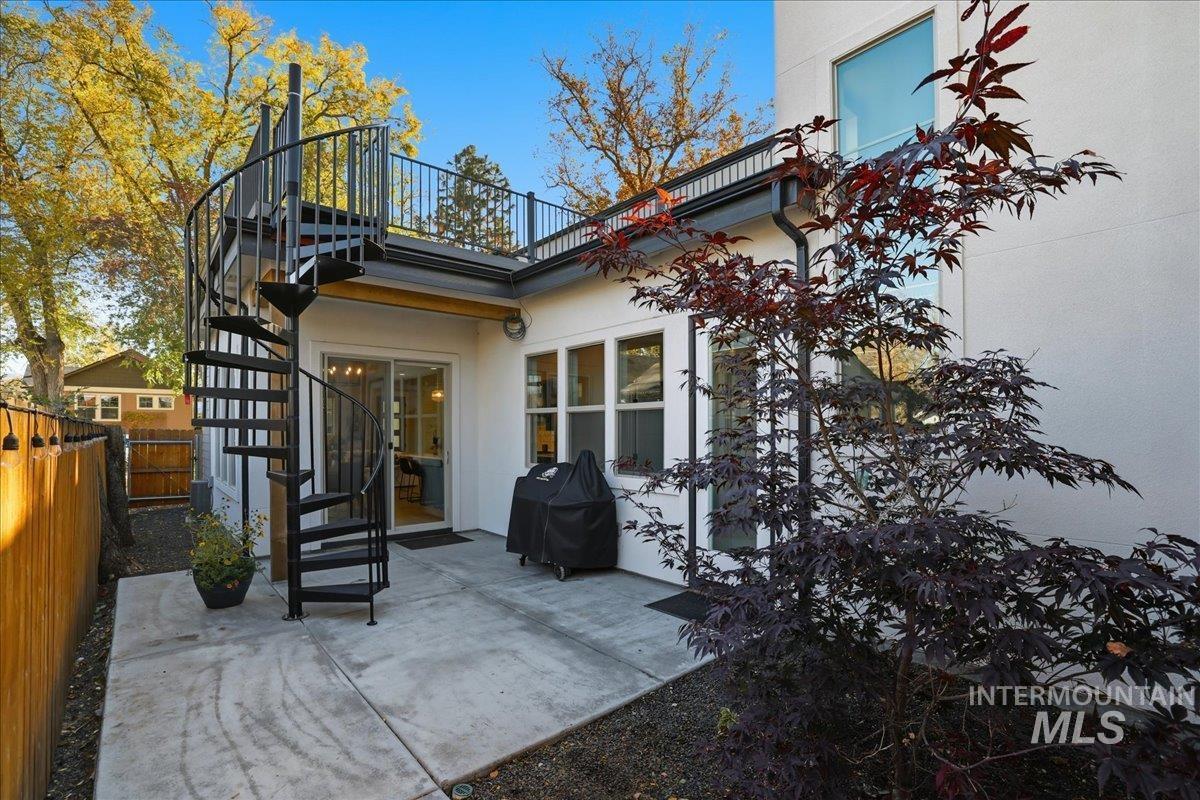 2129 North 34th Street Boise, ID 83703 - Photo 39 of 50 Rear view of property featuring stairs, a patio area, and stucco siding