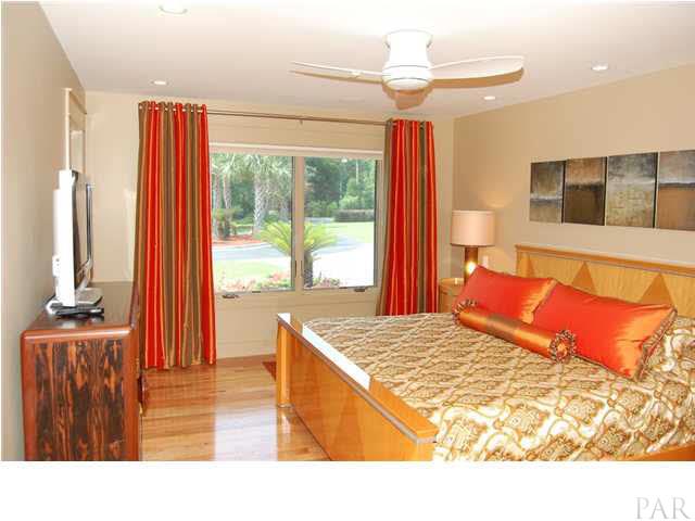 4380 Berryhill Road Pace, FL 32571 - Photo 11 of 24 Master bedroom. Minka ceiling fan, walk in closet w/custom maple cabinets, shoe racks, laundry bins & 49' of hanging space. Wired for sound, TV & internet.