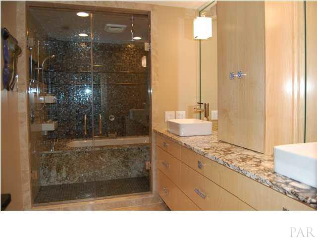 4380 Berryhill Road Pace, FL 32571 - Photo 12 of 24 Granite tub surround, Baine Ultra Chromatherapy, heated backrests, 2 shower stations, 4 shower heads, rain shower, Brizo faucets, Porcher toilet, Maple cabinets & granite tops.