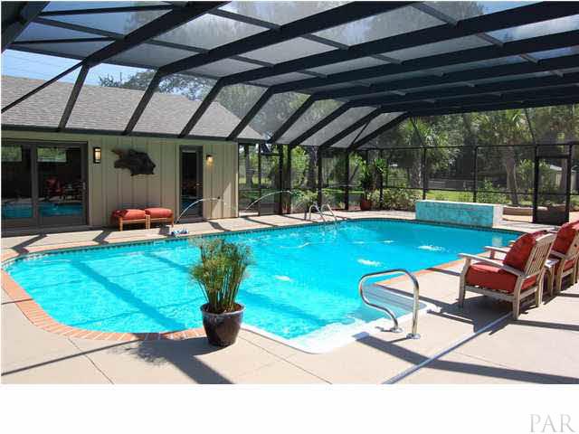 4380 Berryhill Road Pace, FL 32571 - Photo 16 of 24 18 x 38 custom pool. Hurricane rated lanai, 20 gauge screen,custom concrete decking, custom water feature, water fall, Fiber Optic lighting, 2 pool pumps, polaris & filtration system.