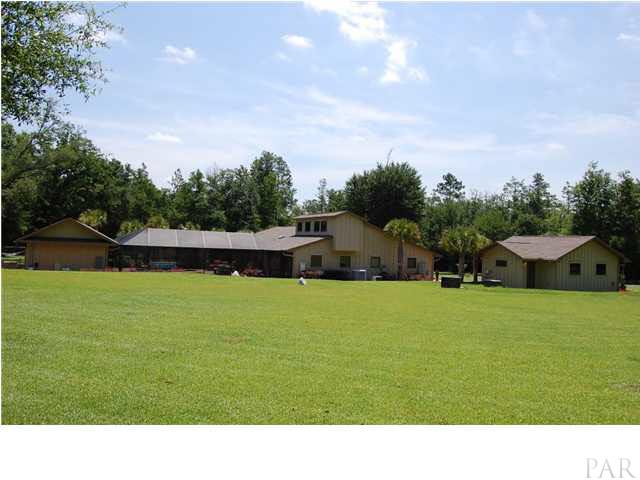 4380 Berryhill Road Pace, FL 32571 - Photo 23 of 24 Eleven zone irrigation system driven by 2 deep wells, allows you to maintain 4 acres of beautiful manicured lawn & the gardens.