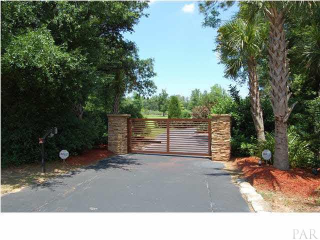 4380 Berryhill Road Pace, FL 32571 - Photo 24 of 24 Gated entry has battery powered backup. Asphalt driveway, custom paver stone driveway to house & detached garage w/workshop area.