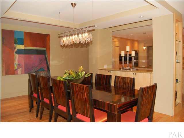 James R. Modr, Swarovski Crystal Chandelier, buffet with pull outs, lite display shelving at each end, power outlets, granite & view of the lanai & pool.