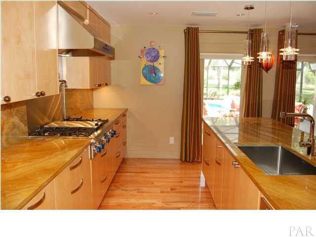 4380 Berryhill Road Pace, FL 32571 - Photo 9 of 24 Arfican Granite countertop & backsplash. Thermador Pro Series 5 burner cooktop, Thermador Pro Hood w/heat lamps & built in Pot Filler. Miele dishwasher.