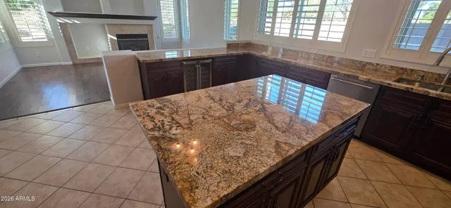 view of an empty room with wooden floor and a window