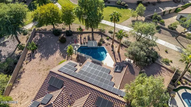 a view of a chandelier fan and closet in a room