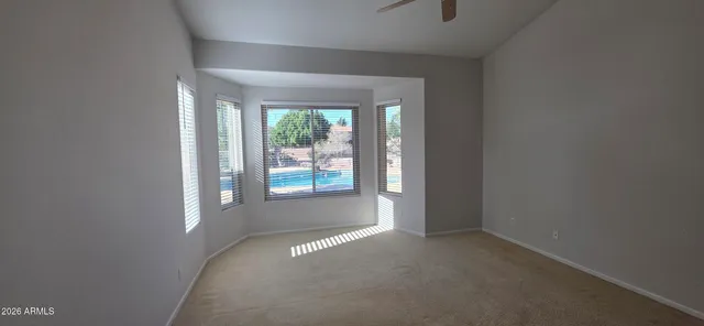 an empty room with wooden floor and closet