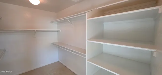 a view of a room that has a mirror in it