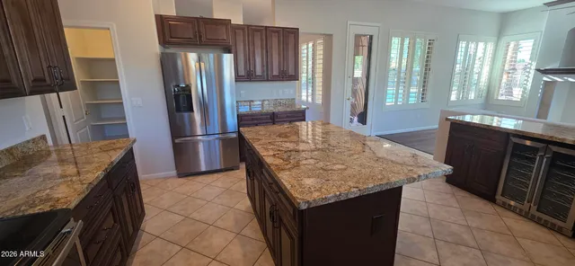 a view of a livingroom with a ceiling fan and window
