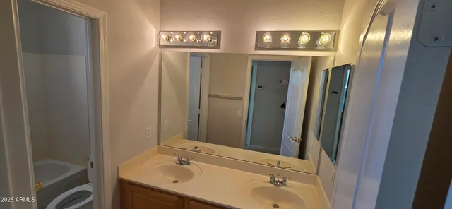 a view of a house with pool and sitting area