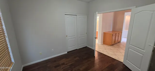 a view of a street with cars on both side of road