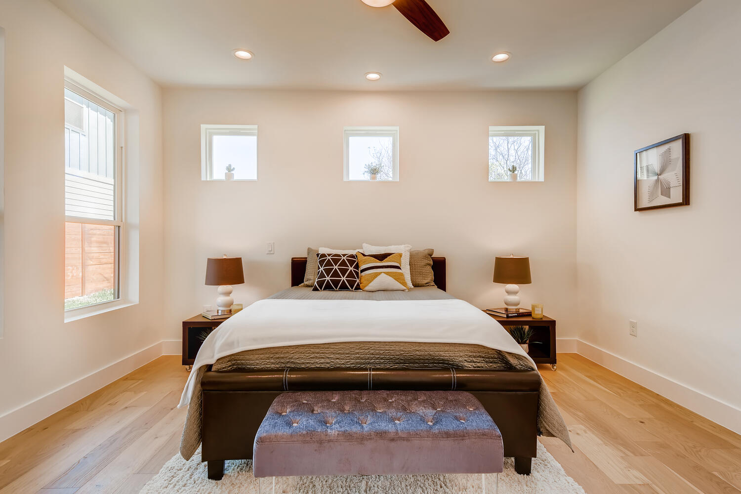 505 Kemp Street Austin, TX 78741 - Photo 15 of 34 Main-level primary suite with warm floors, soft natural light, and an easy, calm feel.