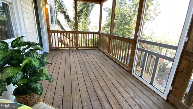 a view of balcony with wooden floor