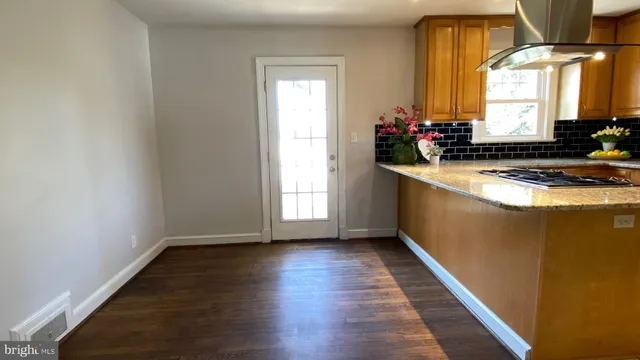 a kitchen with sink and window