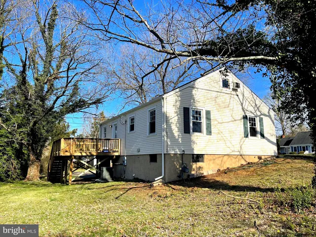 a view of yard and car parked