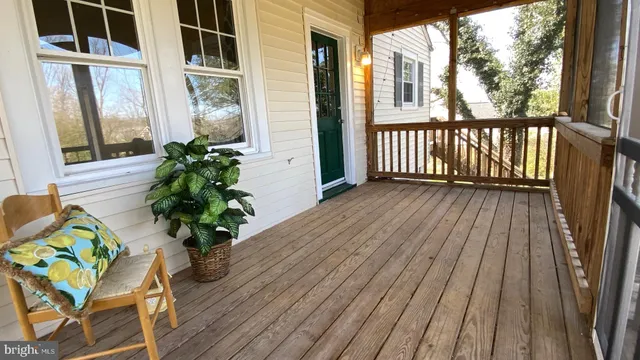 a view of a balcony with potted plants