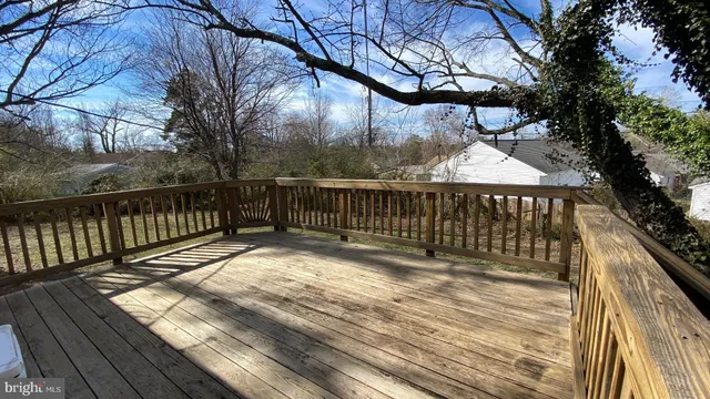 a view of deck with wooden floor and outdoor seating