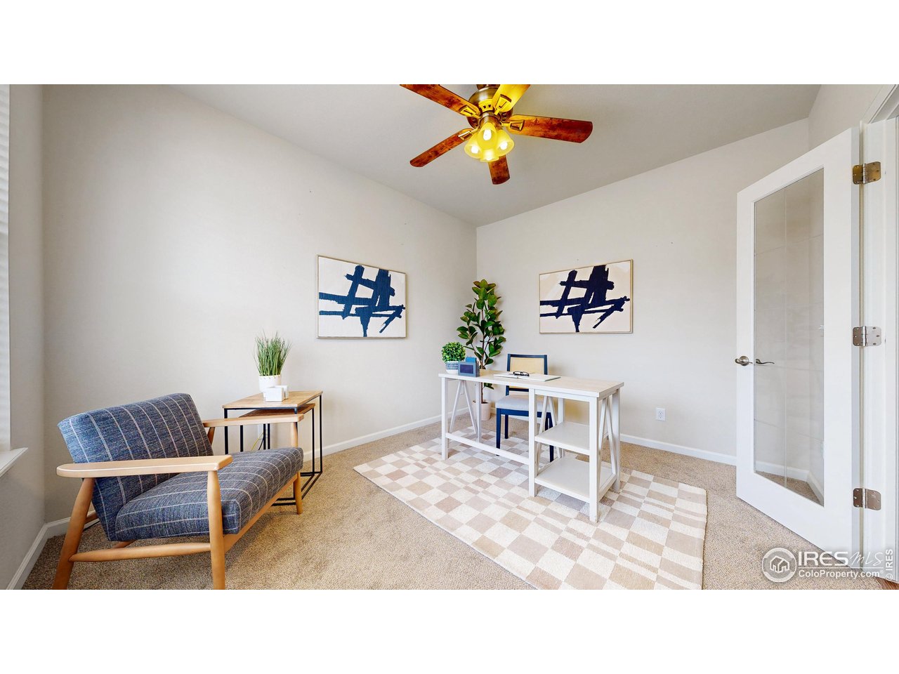6748 Rainier Road Timnath, CO 80547 - Photo 12 of 34 a living room with furniture and a rug