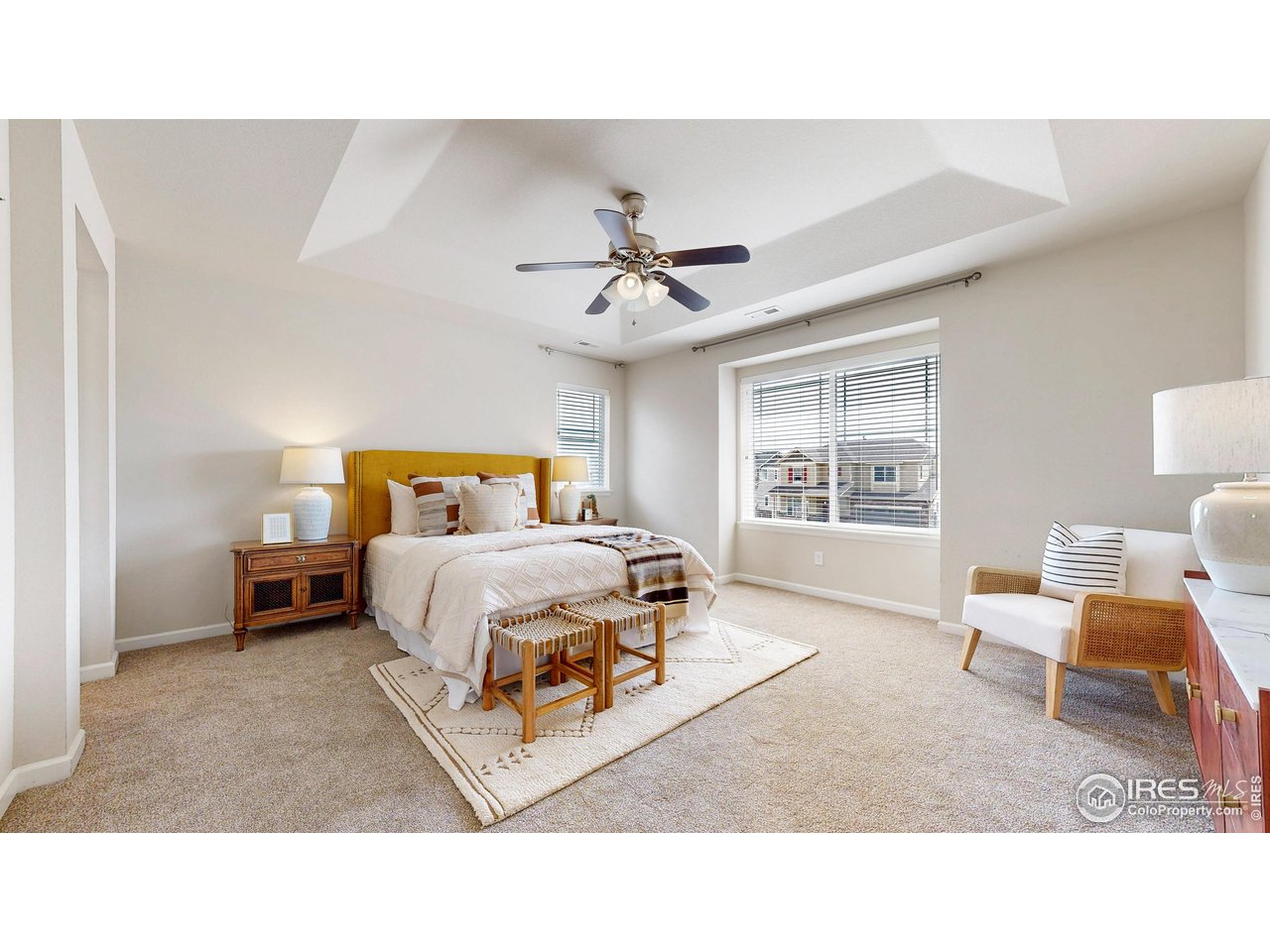 6748 Rainier Road Timnath, CO 80547 - Photo 14 of 34 a bedroom with a bed and window