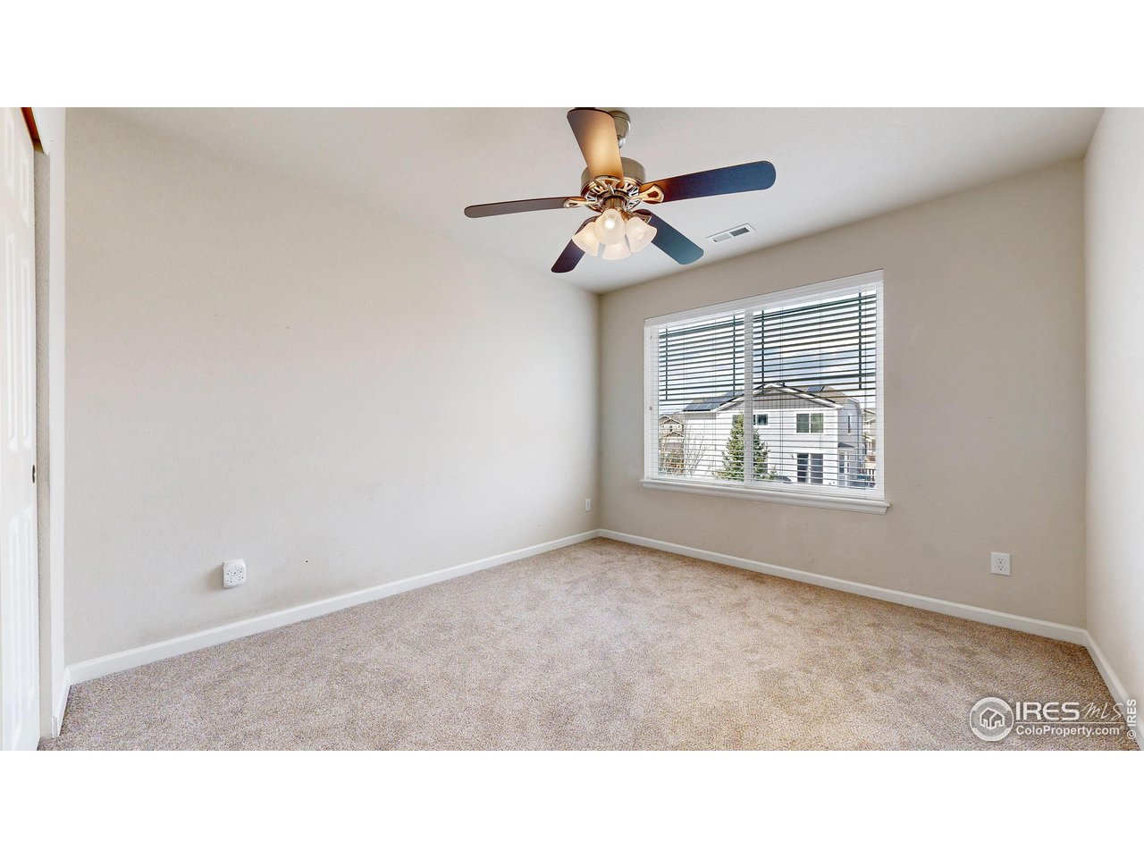 6748 Rainier Road Timnath, CO 80547 - Photo 20 of 34 a black and white photo of a living room
