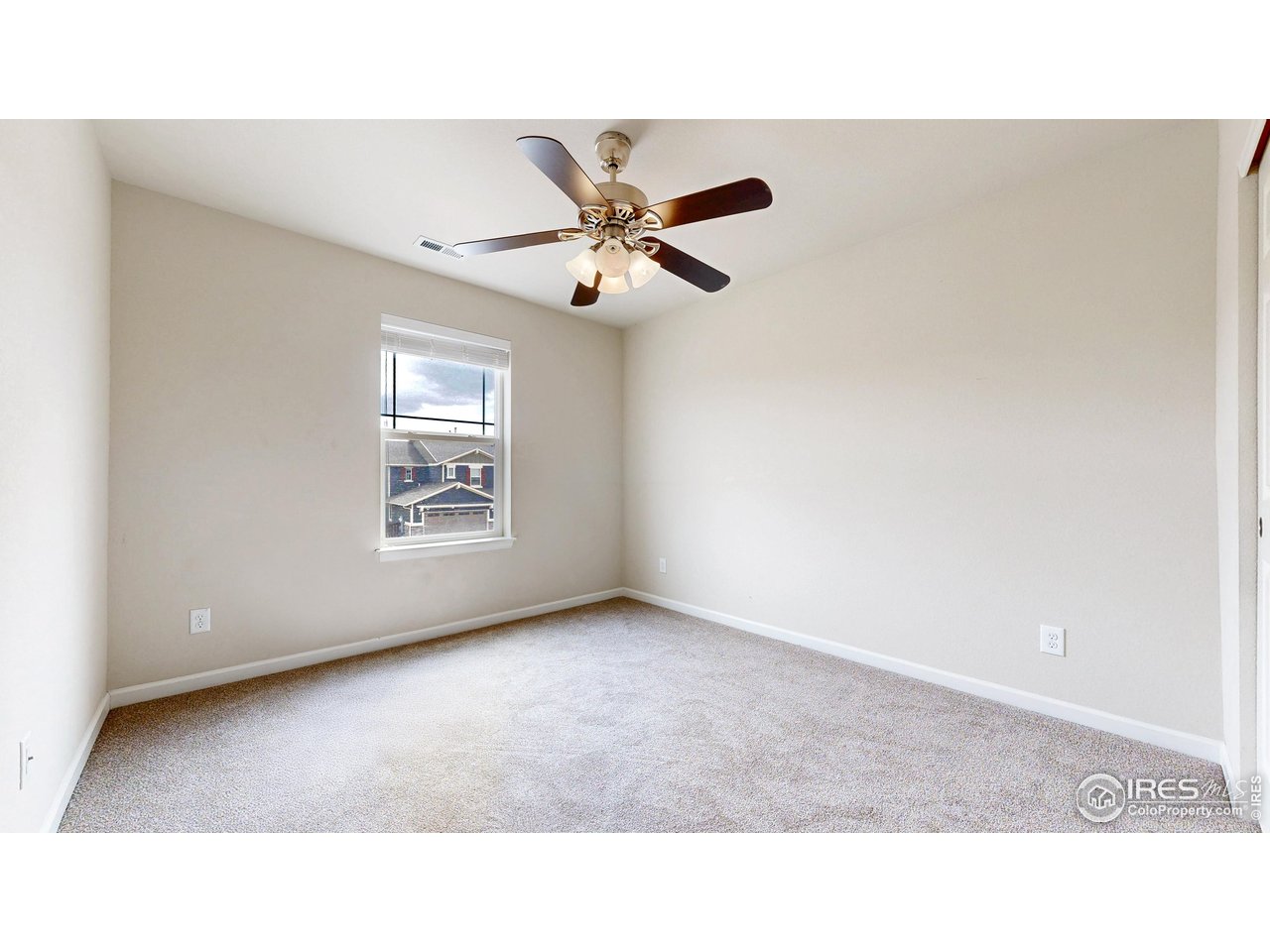 6748 Rainier Road Timnath, CO 80547 - Photo 22 of 34 a open hall with a ceiling fan