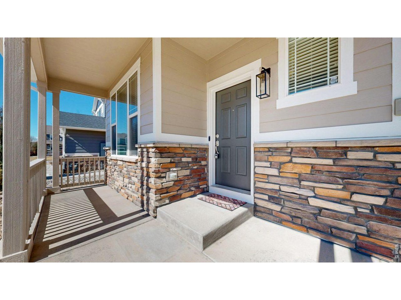 6748 Rainier Road Timnath, CO 80547 - Photo 33 of 34 a black and white photo of a living room