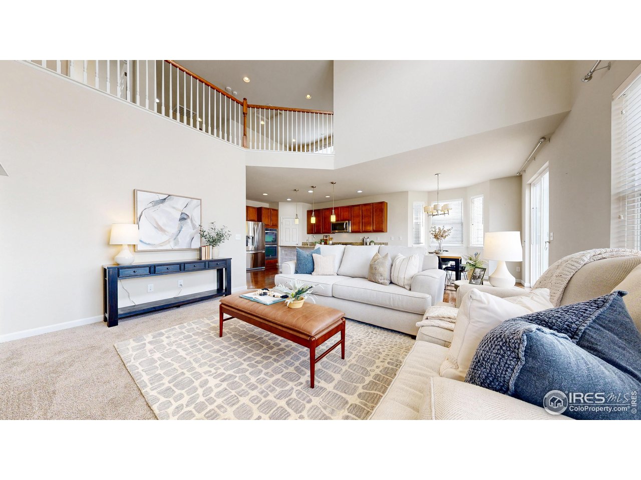 6748 Rainier Road Timnath, CO 80547 - Photo 5 of 34 a living room with furniture and wooden floor