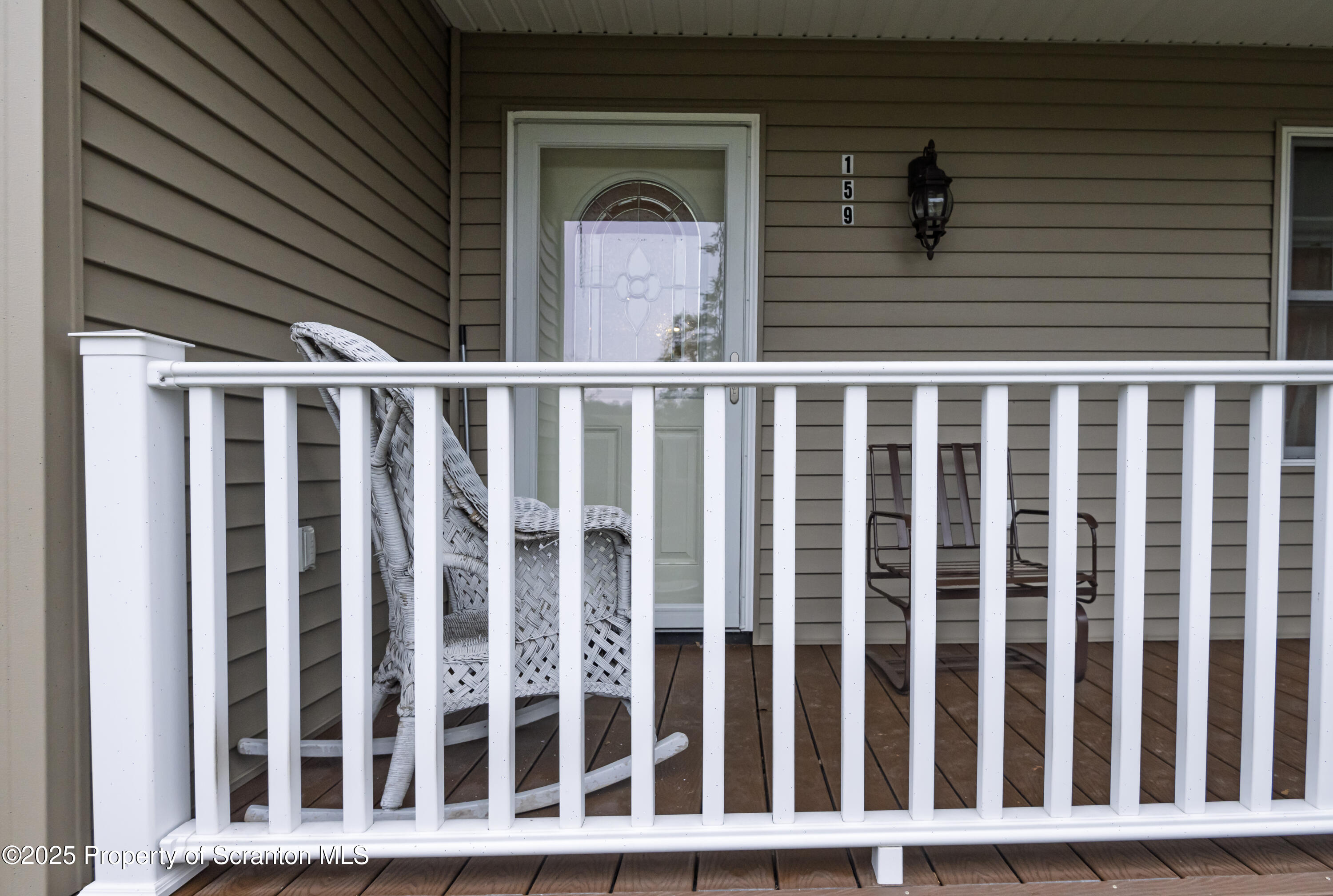 159 Vail Road Factoryville, PA 18419 - Photo 4 of 31 a view of a brick house with wooden fence