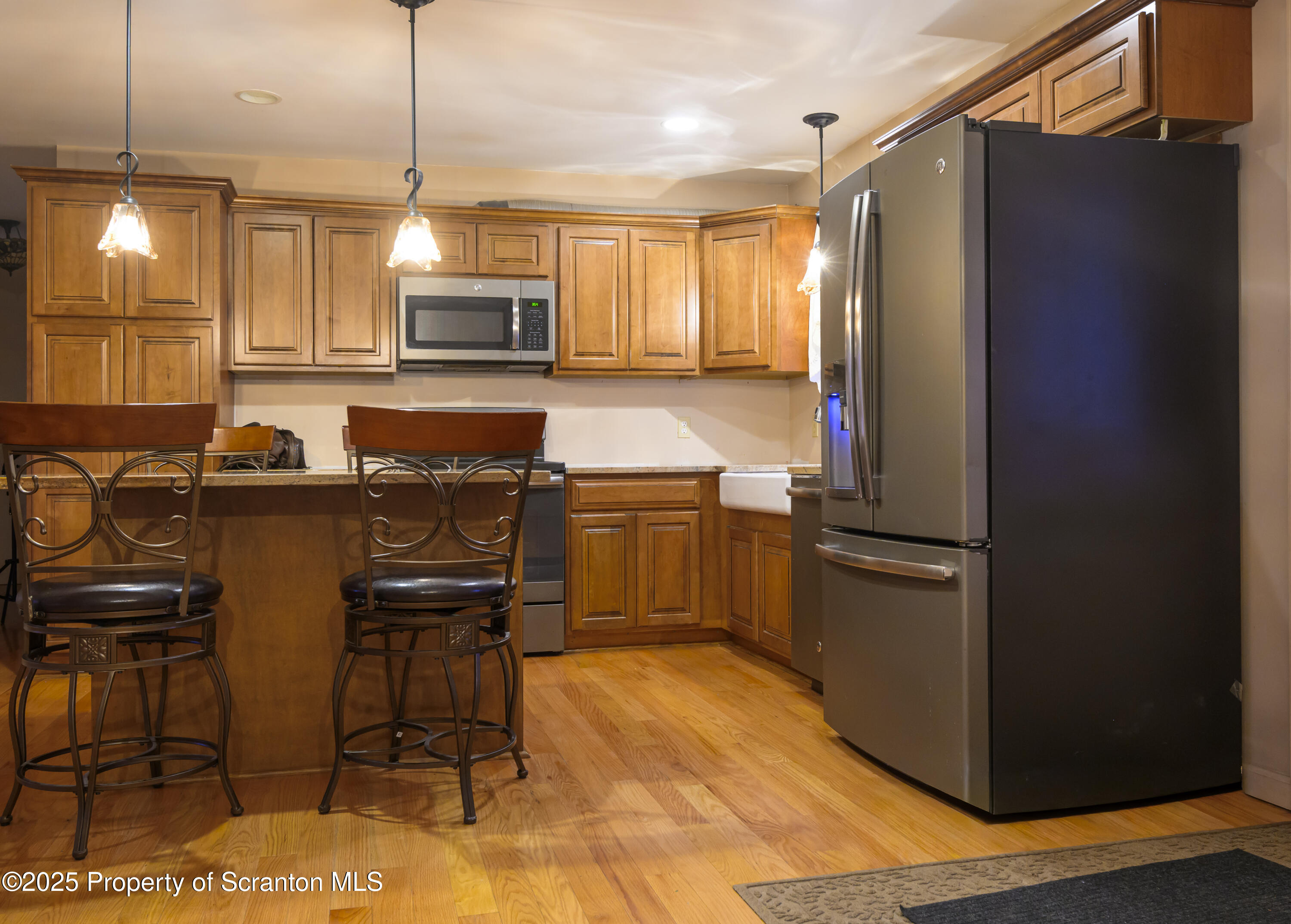 159 Vail Road Factoryville, PA 18419 - Photo 8 of 31 a kitchen with kitchen island a counter top space appliances and cabinets