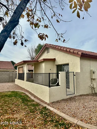 front view of a house with a large window
