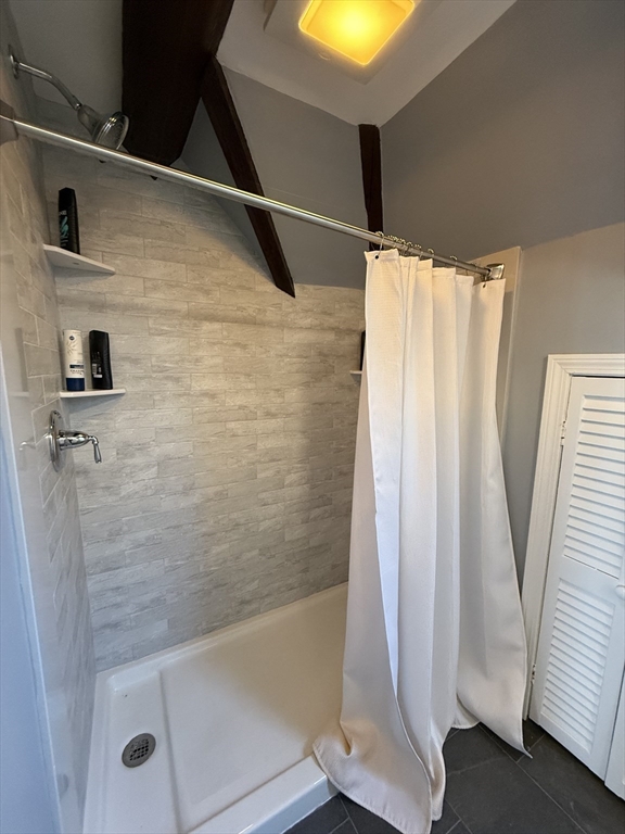 10 High Street, Unit 3 Andover, MA 01810 - Photo 11 of 16 a bathroom with a shower and a tub