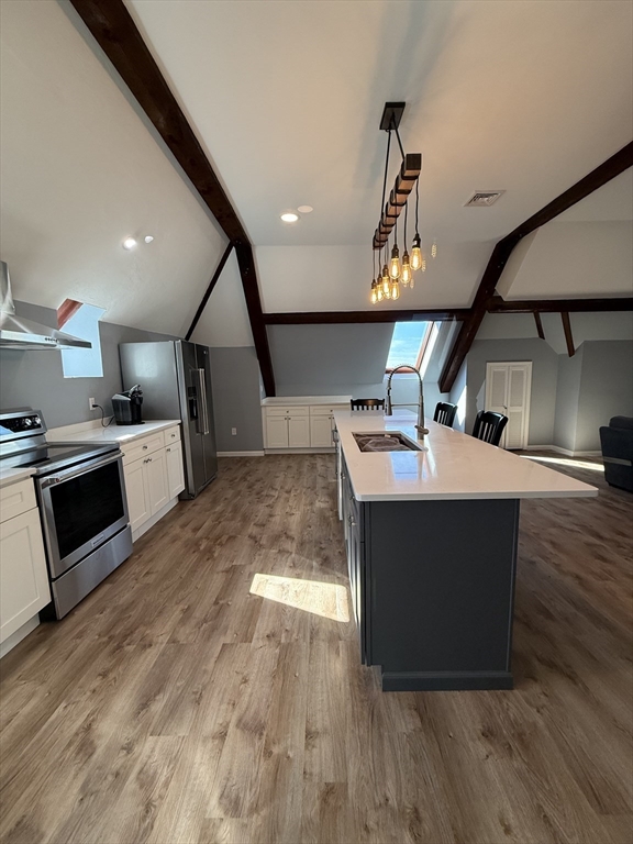 10 High Street, Unit 3 Andover, MA 01810 - Photo 2 of 16 a kitchen with a sink stainless steel appliances and cabinets
