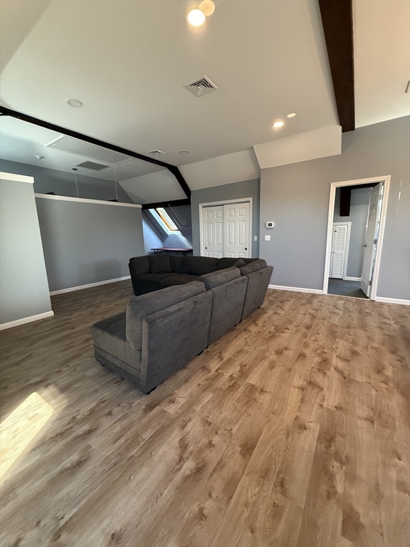 10 High Street, Unit 3 Andover, MA 01810 - Photo 6 of 16 a view of kitchen and empty room with wooden floor
