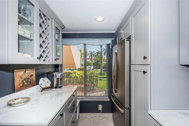 a kitchen with a refrigerator and a stove