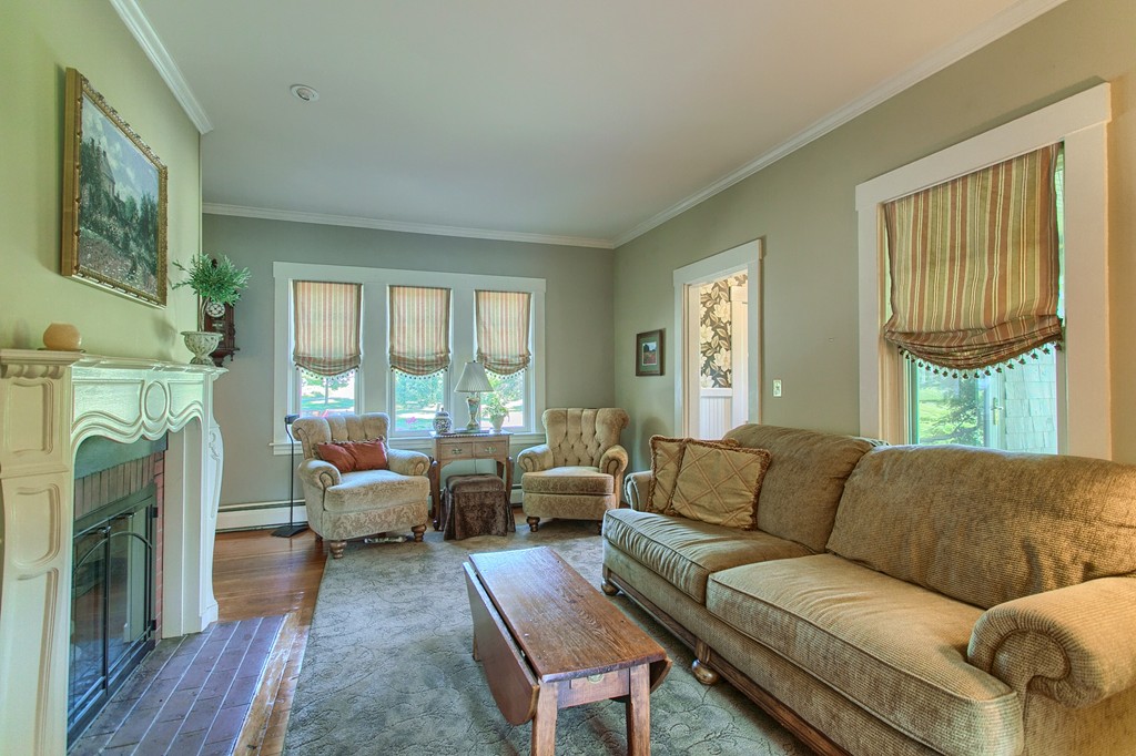 45 Hill Road Groton, MA 01450 - Photo 15 of 30 a living room with furniture large window and a fireplace