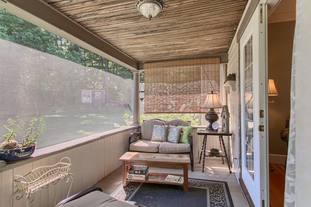 45 Hill Road Groton, MA 01450 - Photo 17 of 30 a balcony with furniture and a potted plant