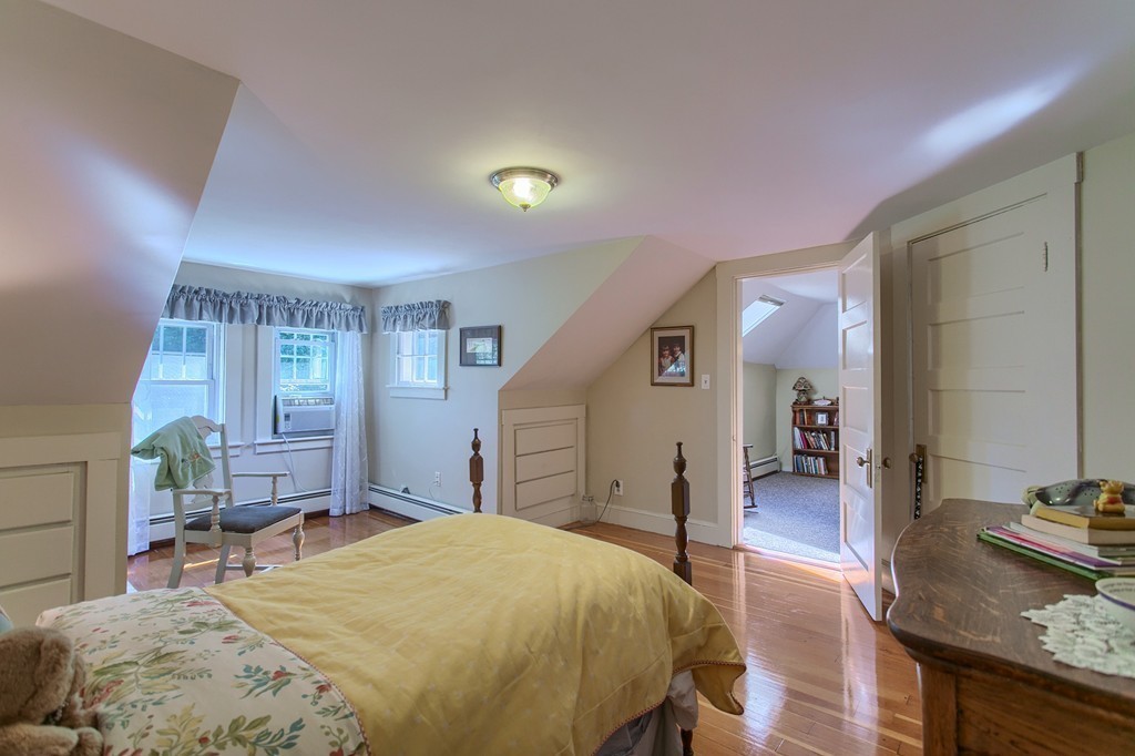 45 Hill Road Groton, MA 01450 - Photo 23 of 30 a bedroom with a bed and wooden floor