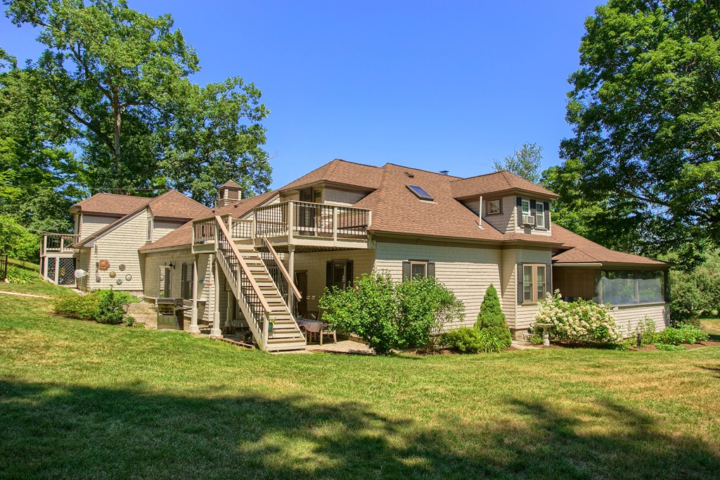 45 Hill Road Groton, MA 01450 - Photo 5 of 30 a front view of a house with a garden