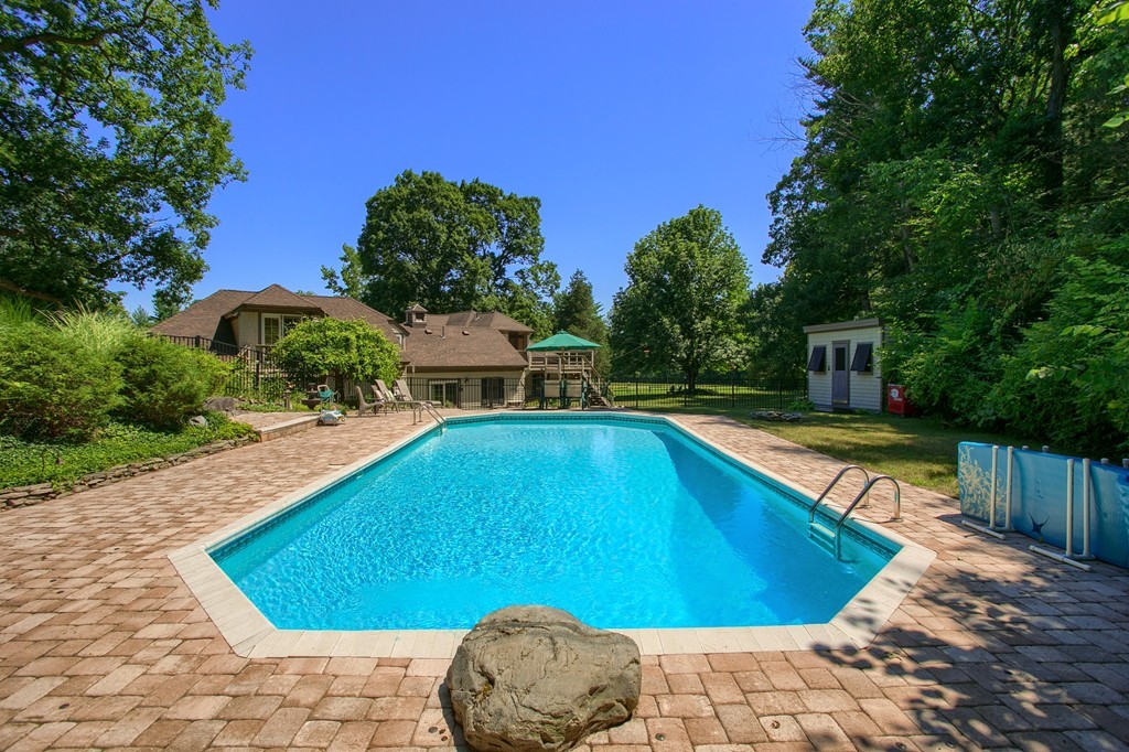 45 Hill Road Groton, MA 01450 - Photo 7 of 30 a view of a swimming pool with a lounge chairs