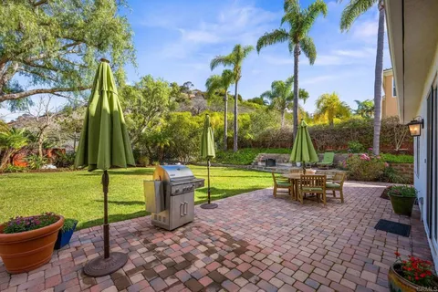 a view of a garden with sitting area