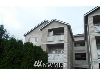 23908 Bothell Everett Highway, Unit A301 Bothell, WA 98021 - Photo 1 of 1 a front view of a house with a yard