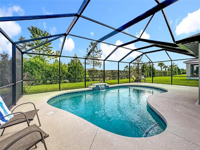 a view of swimming pool with seating area