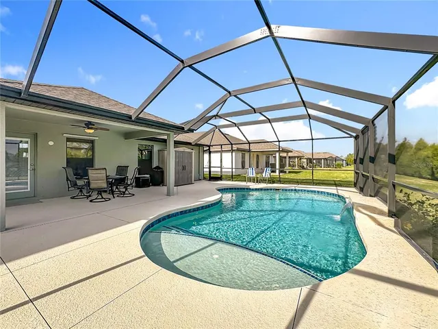 a view of a swimming pool with a patio